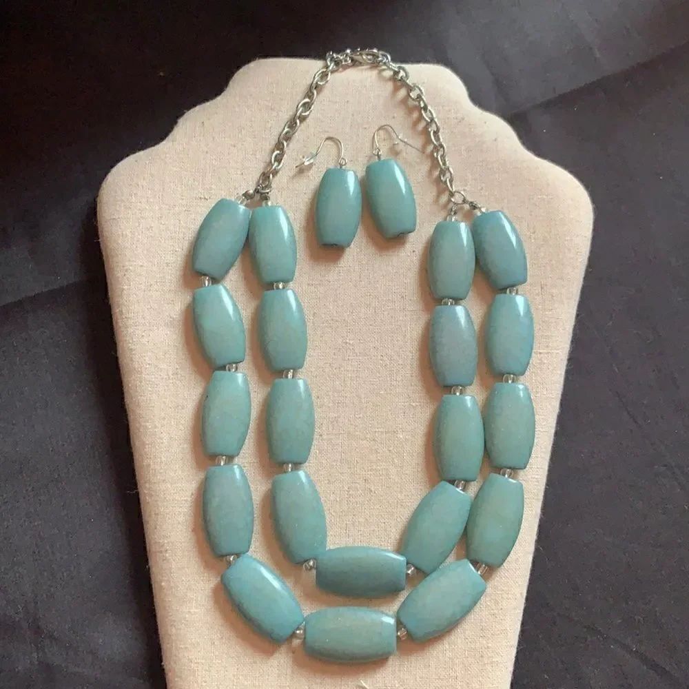 Silver and blue stone necklace and earring set